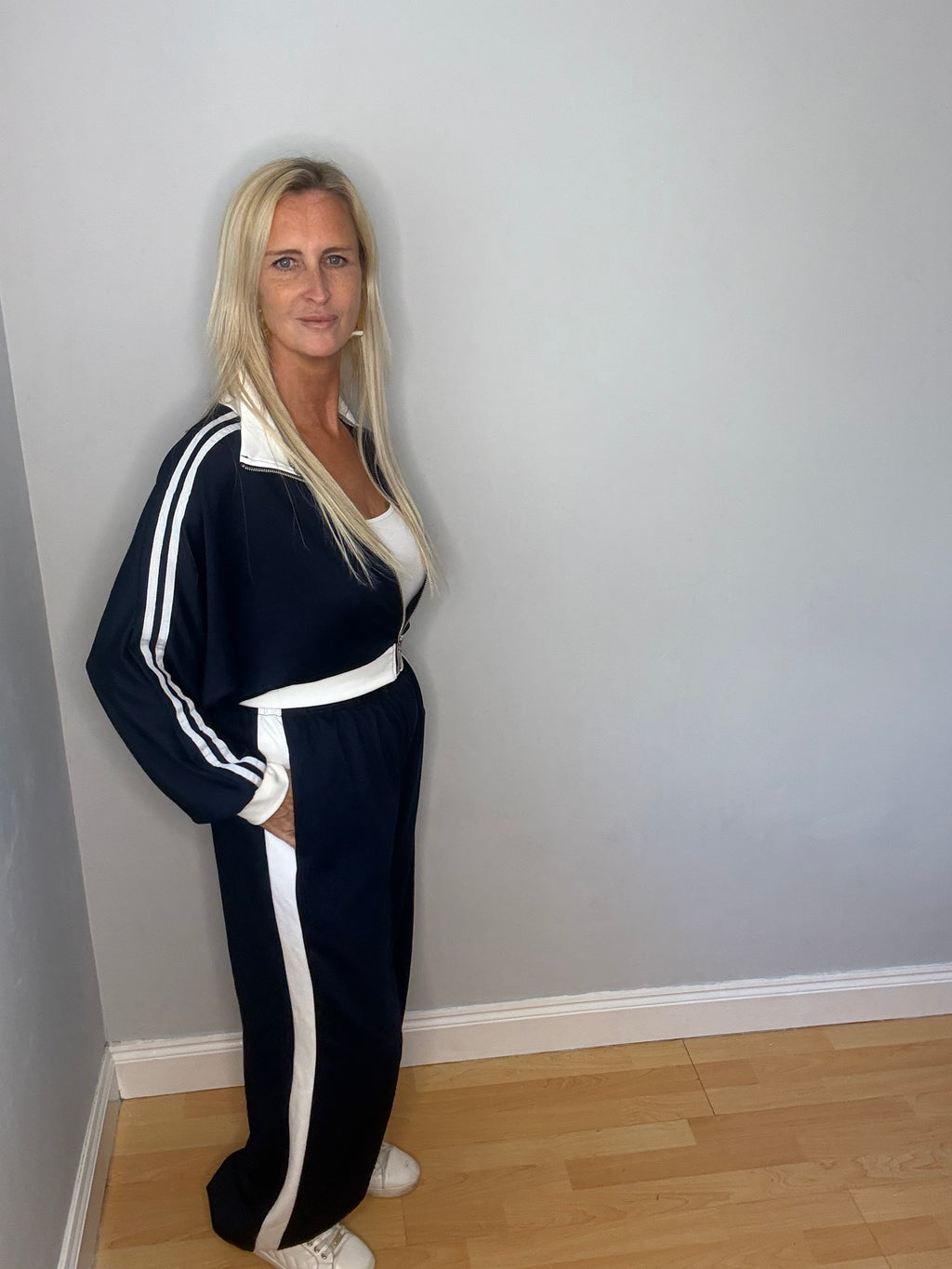 Our Manhattan Tracksuit features zip up jacket with Tracksuit bottoms with a gathered ankle.